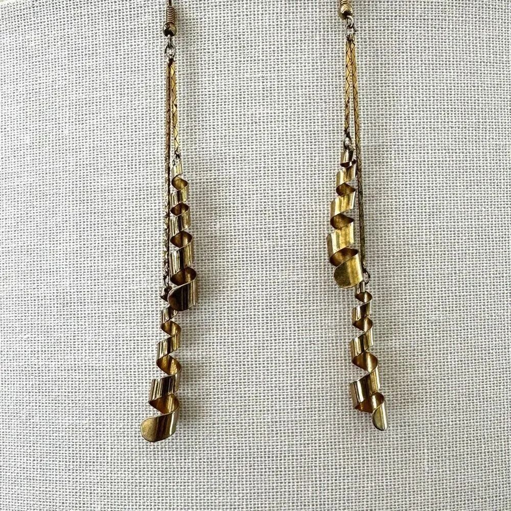 Gold tone โlong coil earrings